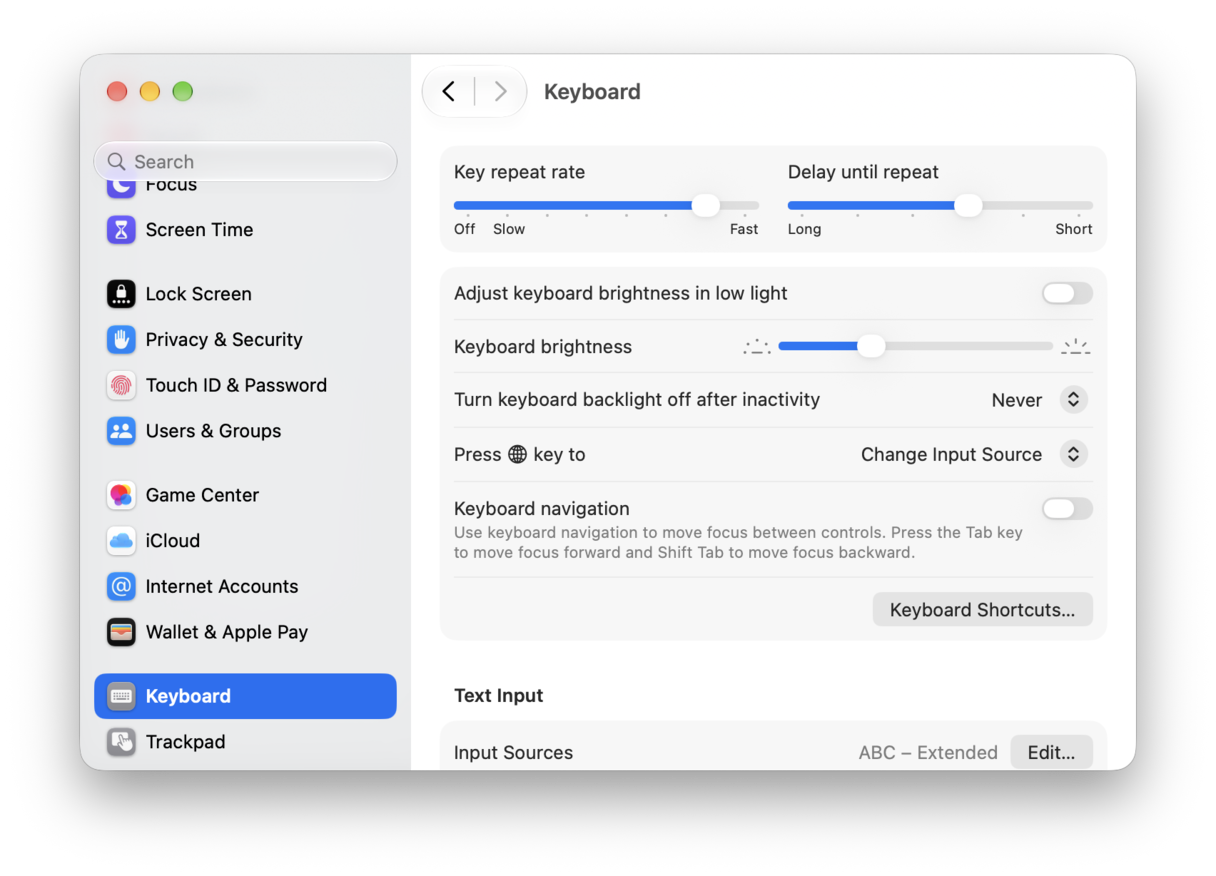 System Preferences - macOS Keyboard settings panel showing key repeat rate, brightness and text input preferences